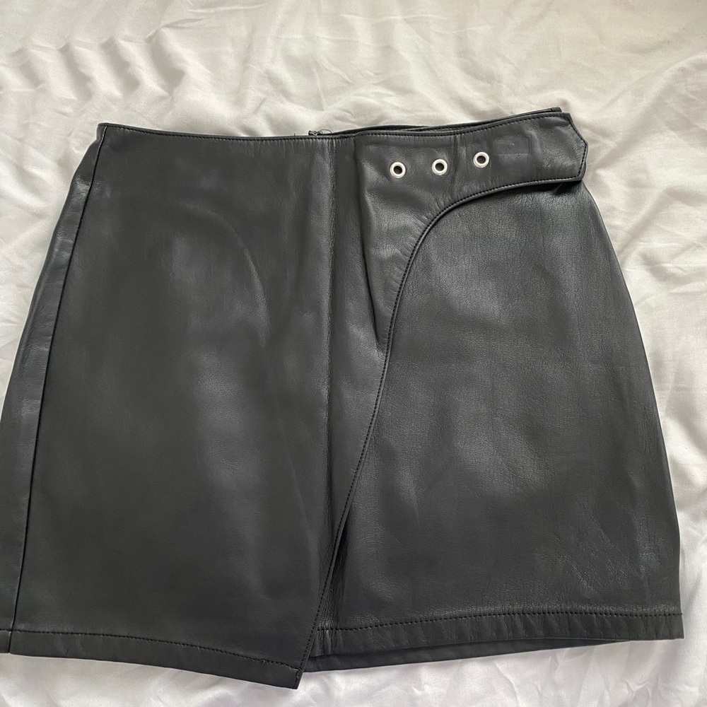 Black Leather mini skirt with silver detailing on waist, size 0